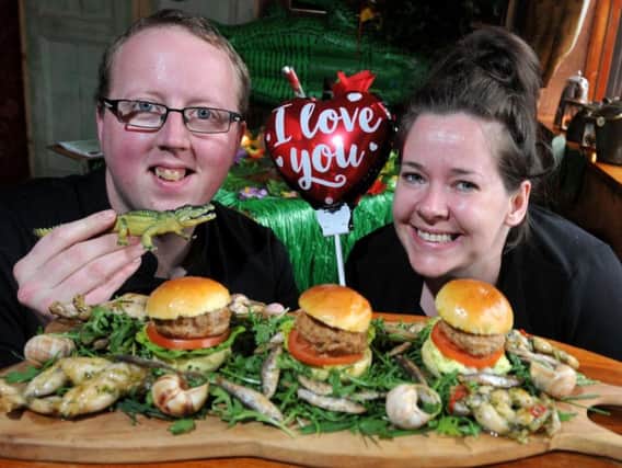 Head chef Mike Robinson and pub manager Andrea OToole with an unusual Valentines Day menu, exotic items such as frogs legs and crocodile sliders