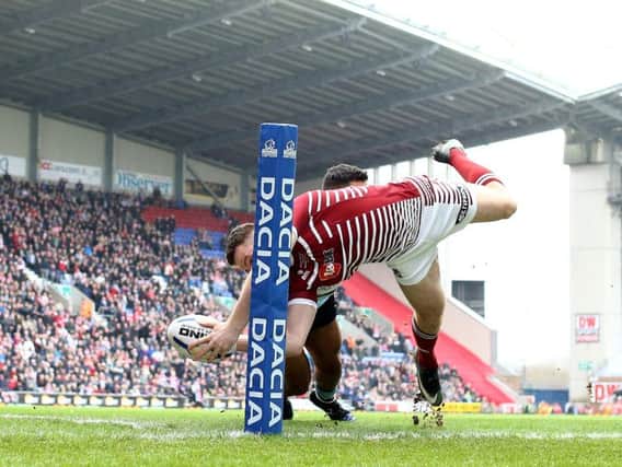Joe Burgess scores a try against Cronulla in the WCC two years ago