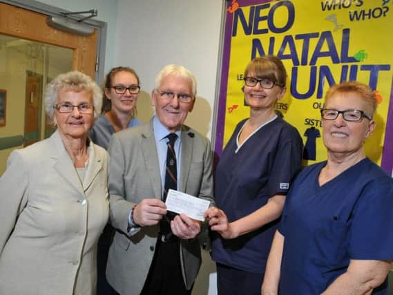 Coun John Hilton and wife Margaret present a 250 cheque to neo-natal staff Jenny Jennings, lead nurse Julie Armstrong and Sue Robinson