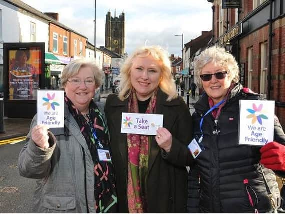 Janet Presho, Pauline Barraclough and Sue Balderstone, promote the Take a Seat campaign, encouraging shops and cafes to be more age-friendly, by offering chairs and refreshments to elderly members of the community.