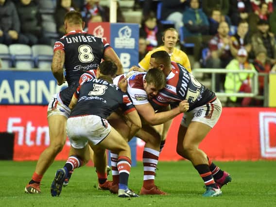 Joe Greenwood is held-up during Wigan's World Club Challenge defeat to Sydney Roosters