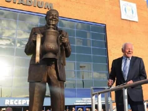 Dave Whelan with the statue at its unveiling