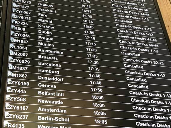 A departure board at Bristol Airport showing flybmi flights cancelled following the collapse of the airline