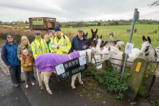 Jimmy and Gillian Morris, with sons Tom and Andrew pictured in 2016 with members of The Bell Greenbelt Development Group protesting against plans to build in the area