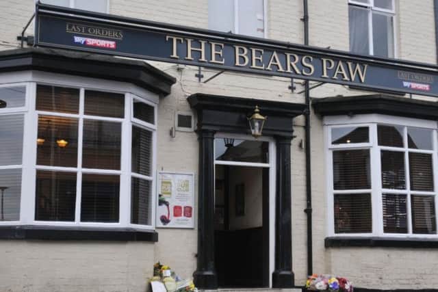 Flowers were left outside The Bears Paw pub