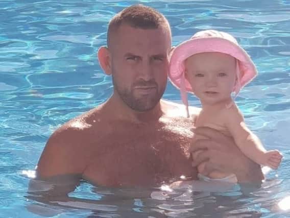 Daniel pictured with Hollie on holiday