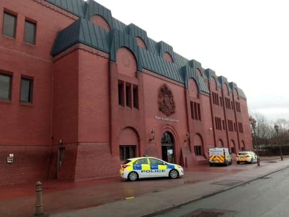 Police vehicles outside Wigan and Leigh Magistrates' Court on Wednesday morning