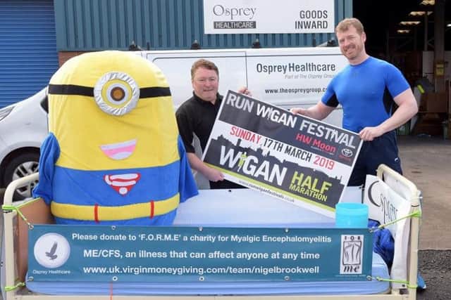 Nigel Brookwell, right, with the bed he will push around the half marathon, donated by Paul King, managing director of Osprey Healthcare, left