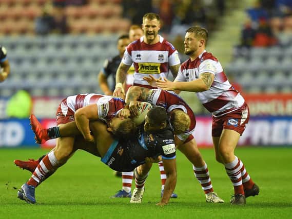 Wigan in action against Huddersfield