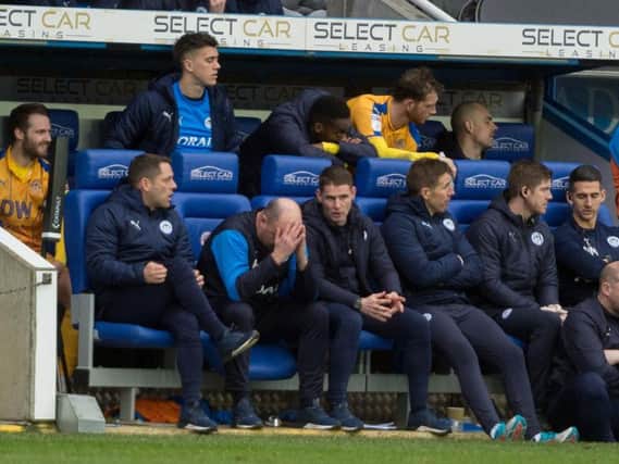 Paul Cook shows his frustration during Saturday's loss to Reading