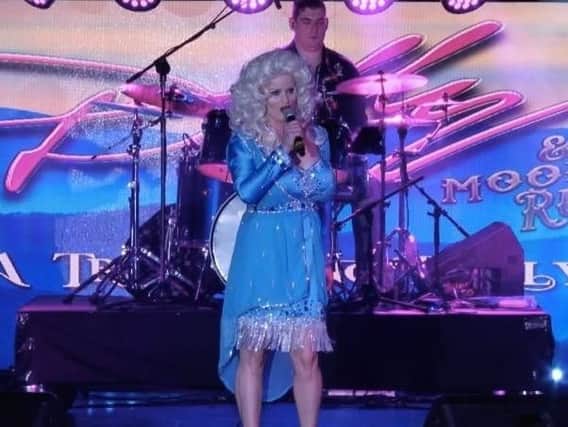 Kay Molyneaux as Dolly Parton, with fianc Joe Curtis on drums