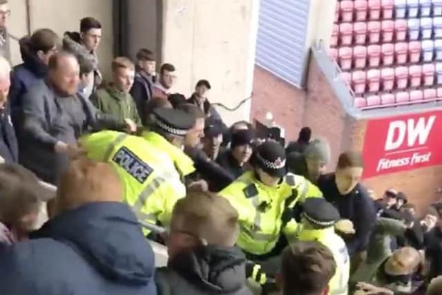 Bolton supporters clashed with police at the DW Stadium. Captured by Reece Jones