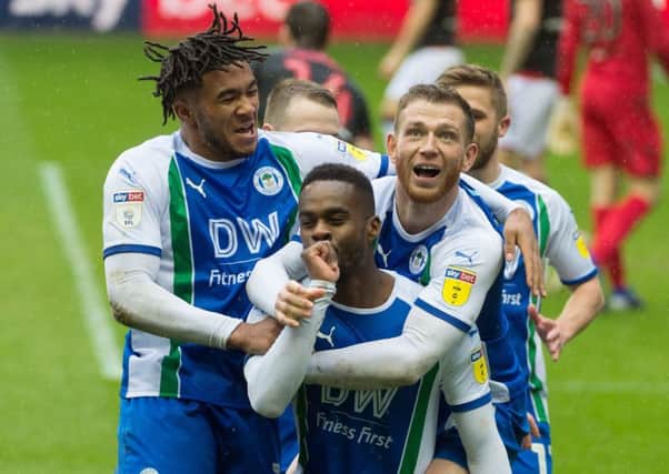 Gavin Massey is mobbed after scoring Wigan Athletic's second goal against Bolton