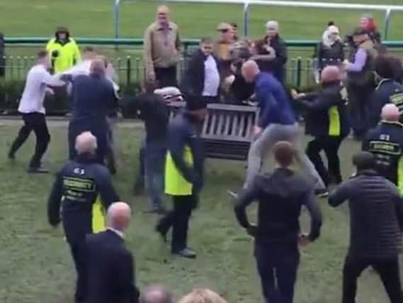 Officials at Haydock Park racecourse have agreed to beef up security after a mass brawl at a recent meeting