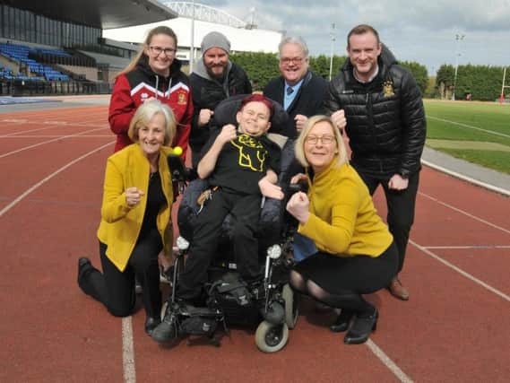 Matthew Unsworth at Robin Park Arena with supporters from Daffodils Dreams, Pianos, Pies and Pirouettes and Wigan Warriors Ladies
