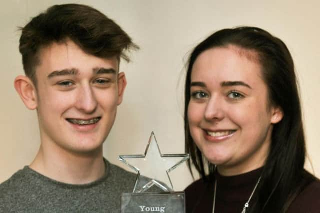 Joshua and Jessica with the award