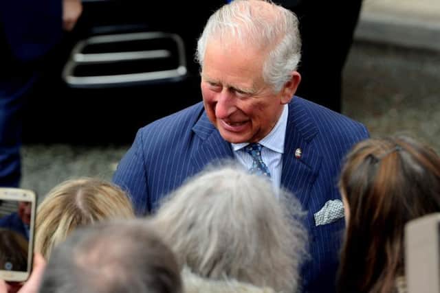 HRH Prince Charles greets people outside The Old Courts in Wigan