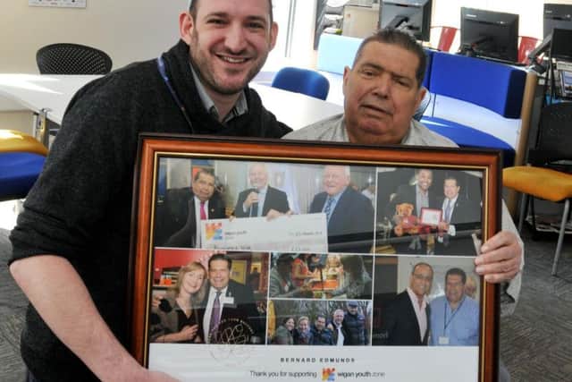 Bernard Edmunds receiving a framed tribute from CEO Anthony Ashworth-Steen
