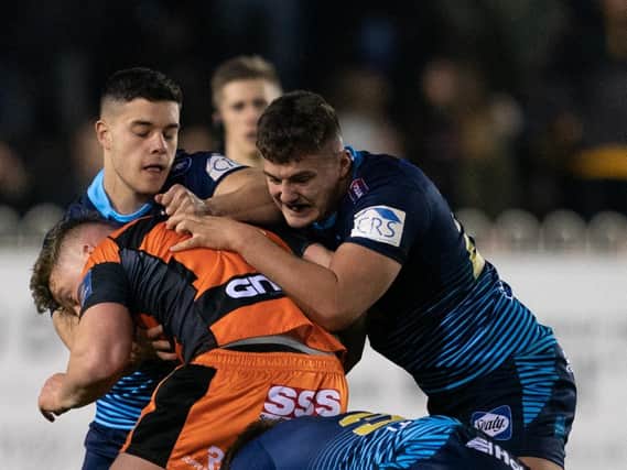 Ollie Partington (right) joins James Shorrocks in defence at Castleford last week