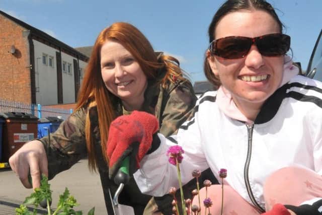Michelle Corsair from Nomad Rangers, left, with a volunteer from Skills CIC,