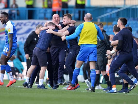 Paul Cook celebrates Wigan Athletic's win