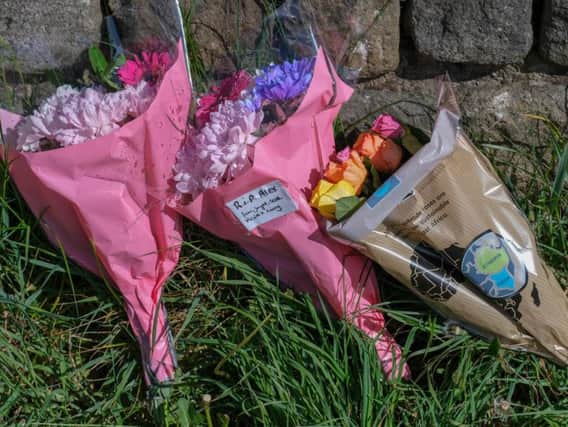 Flowers left close to the scene where Alex was found