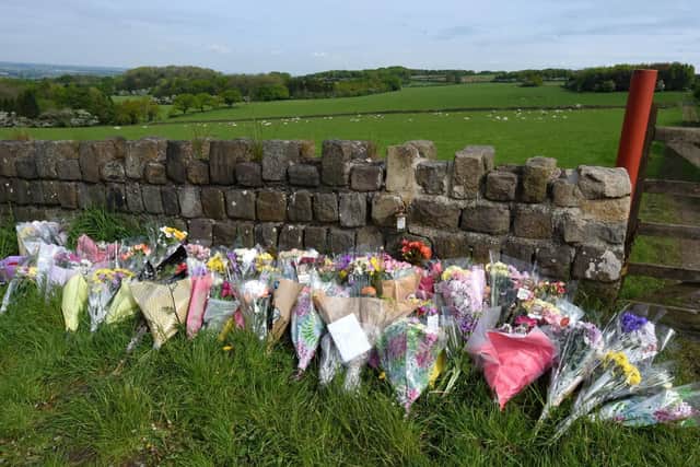 Floral tributes have been laid