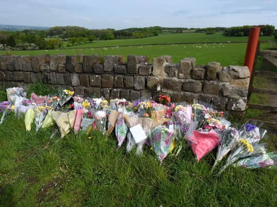 Floral tributes have been laid