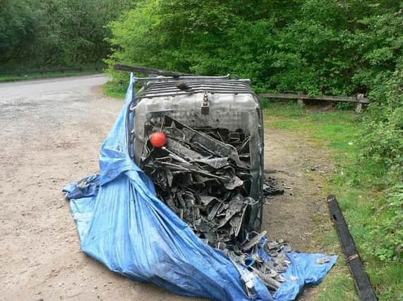 A large container full of hazardous waste was left at Three Sisters