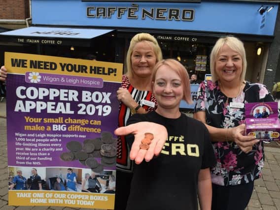 Christine Edwardson, left, and Maxine Armstrong, right, launch the Copper Box Appeal, with Cassie Ashton, centre, from Caffe Nero, Standishgate, which is one of the pick up points for the boxes
