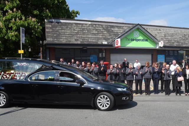 Friends, colleagues and members of the public created a guard of honour outside the Co-op shop, Pole Street, Standish, for the funeral of former Co-op staff member Joan Carter.