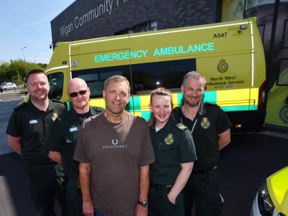 Steve Burbage with the ambulance staff who saved his life