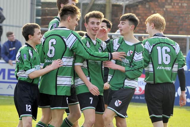 The Charnock Richard players celebrate Brad Whittle's (second from right) third goal against Tyldesley in the Lancashire FA U15 County Cup Final in 2015
