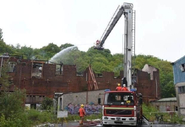 Firefighters at the scene following the initial blaze