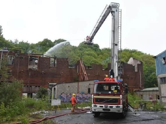 Firefighters at the scene following the initial blaze