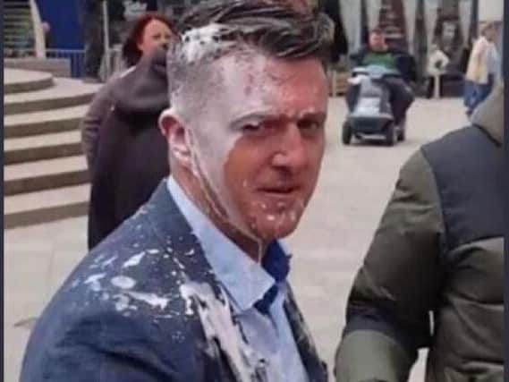 Tommy Robinson after being drenched in milkshake