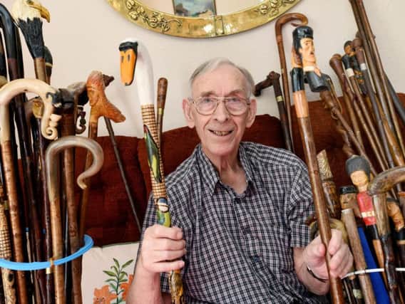 Frank Walton and his collection of walking sticks