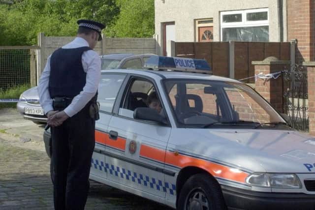 Police outside the scene of the crime in 2001