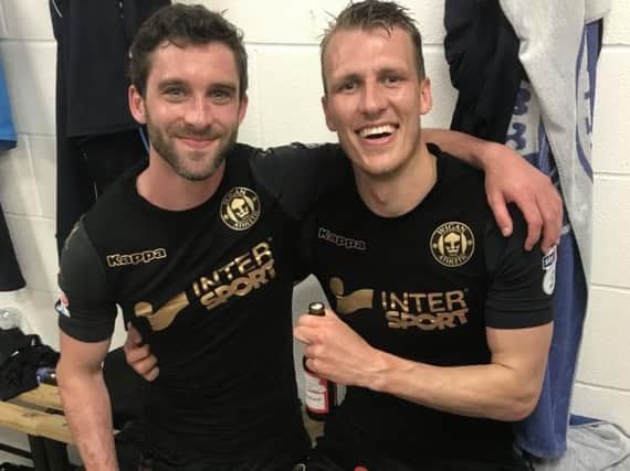 Will Grigg, celebrating another promotion with Dan Burn