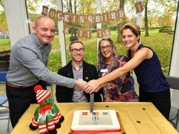 Celebrating the anniversary of Wigan Councils Mockingbird project at Mesnes Park, with James Winterbottom, second left. Services like these are helping offset the problems caused by deep cuts to youth spending