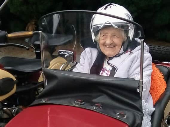 Gladys Cheetham in the sidecar