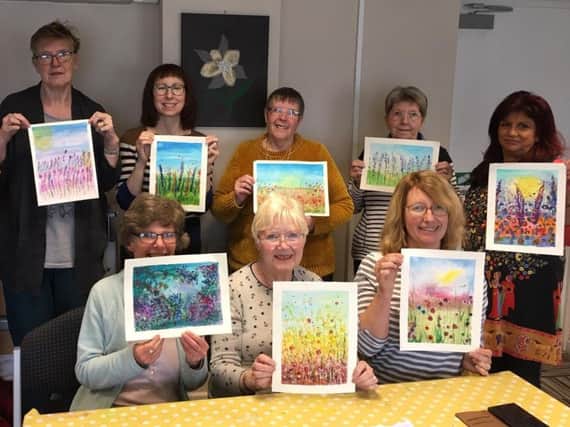 Some of the carers taking part in a therapeutic session with the Wigan and Leigh Carers Centre.