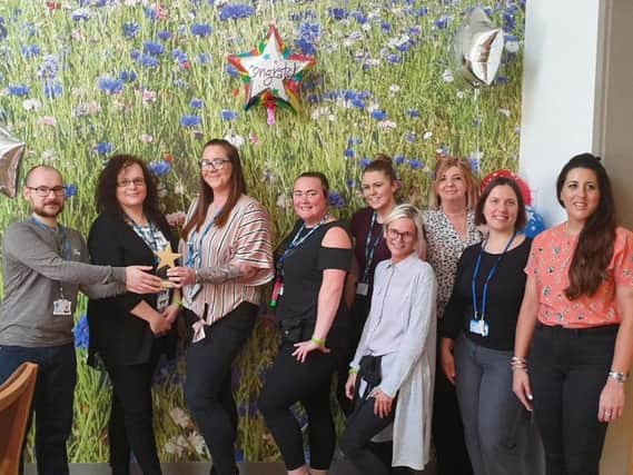 Staff with their Star Wards Full Monty Award
