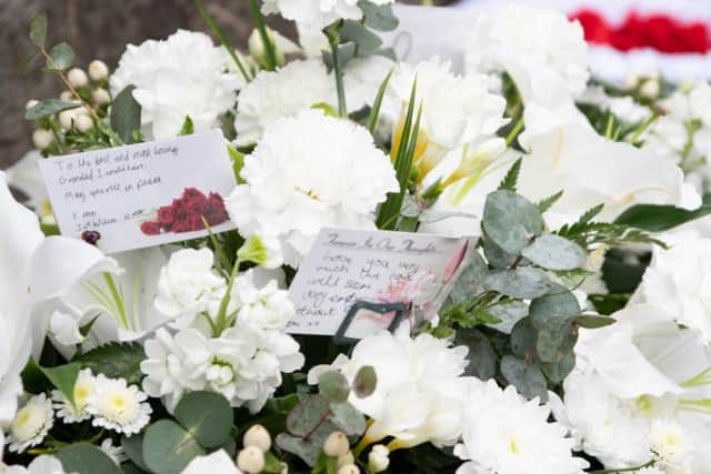 Floral tributes at the funeral of World War Two hero Joe Wilson