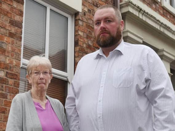 Paul Johnson and neighbour Christine Leaver are at their wits end by the empty flat