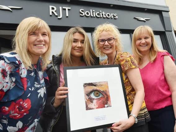 Ailsa is pictured with mum Joanne Hodge (left), Rachel Taylor (second from right) owner of RJT Solicitors, Standish, and solicitor Donna Gamble, competition organisers