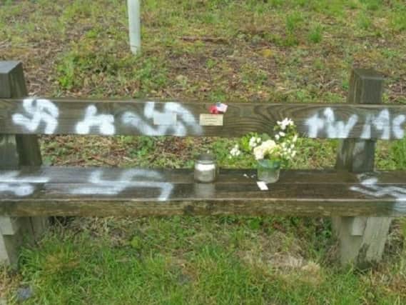 The commemorative bench which has been spray painted