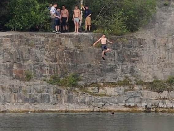 Youngsters flouting safety warnings at the water-filled Appley Bridge quarry