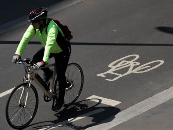 A cyclist using a designated cycle lane