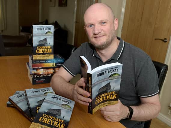 John McKay with his new book Codename: Greyman